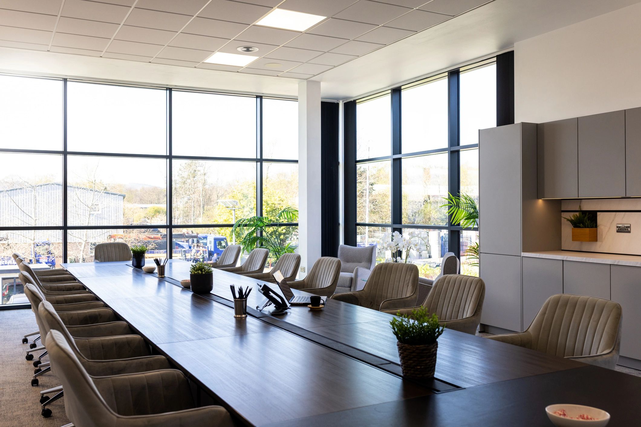 Minimal conference room with large windows and refined architectural interior